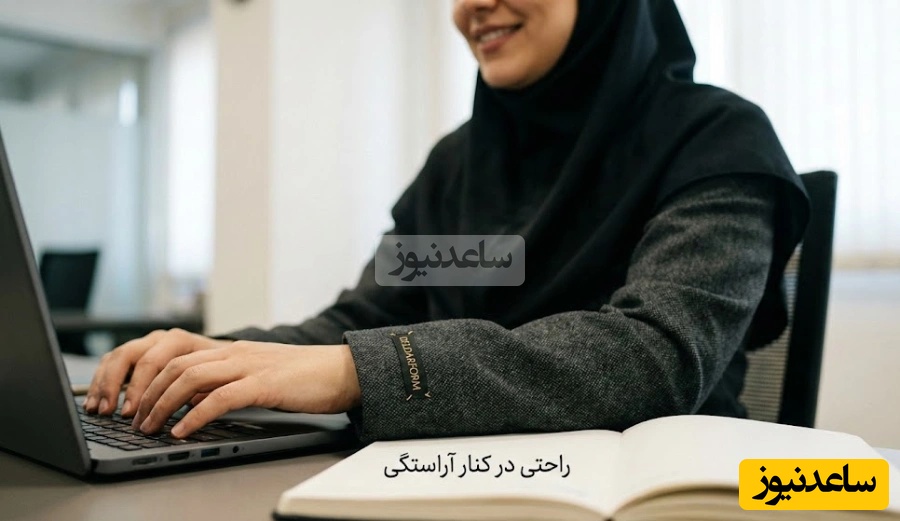 نمای نزدیک از کیفیت پارچه و دوخت لباس اداری زنانه که راحتی کارمند را در حین کار نشان میدهد.