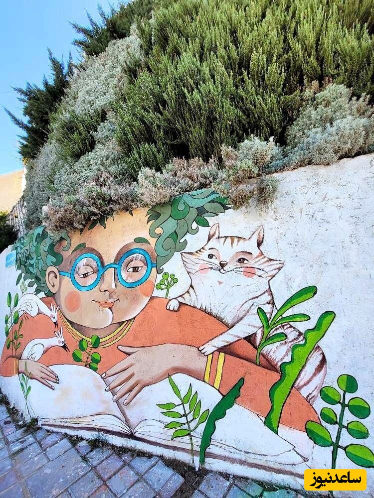 خلاقیت تحسین برانگیز شهرداری در نقاشی دیوار و استفاده از درخت بعنوان موی چهره‌های بانمک و دوست داشتنی+عکس/ بهتر از این نمیشد👌