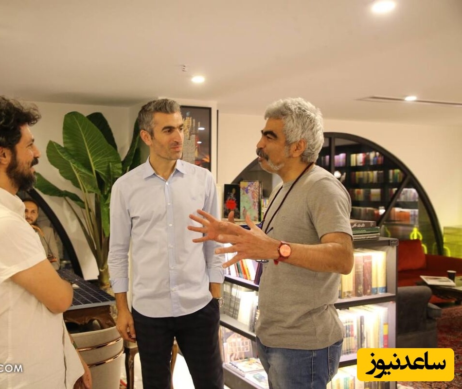 نگاهی به سبک چیدمان کتابفروشی مجتبی جباری در زعفرانیه تهران / از فرش ایرانی و درختچه های بزرگ تا قفسه های پر از کتاب