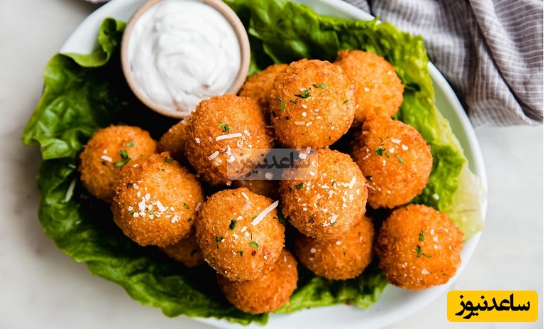 مطمئنم تا حالا توپک‌های سیب‌زمینی به این خوشمزگی نخوردی؛ طرز تهیه این توپک‌های خوشمزه با کمترین مواد ممکن در زمان کم+ویدیو