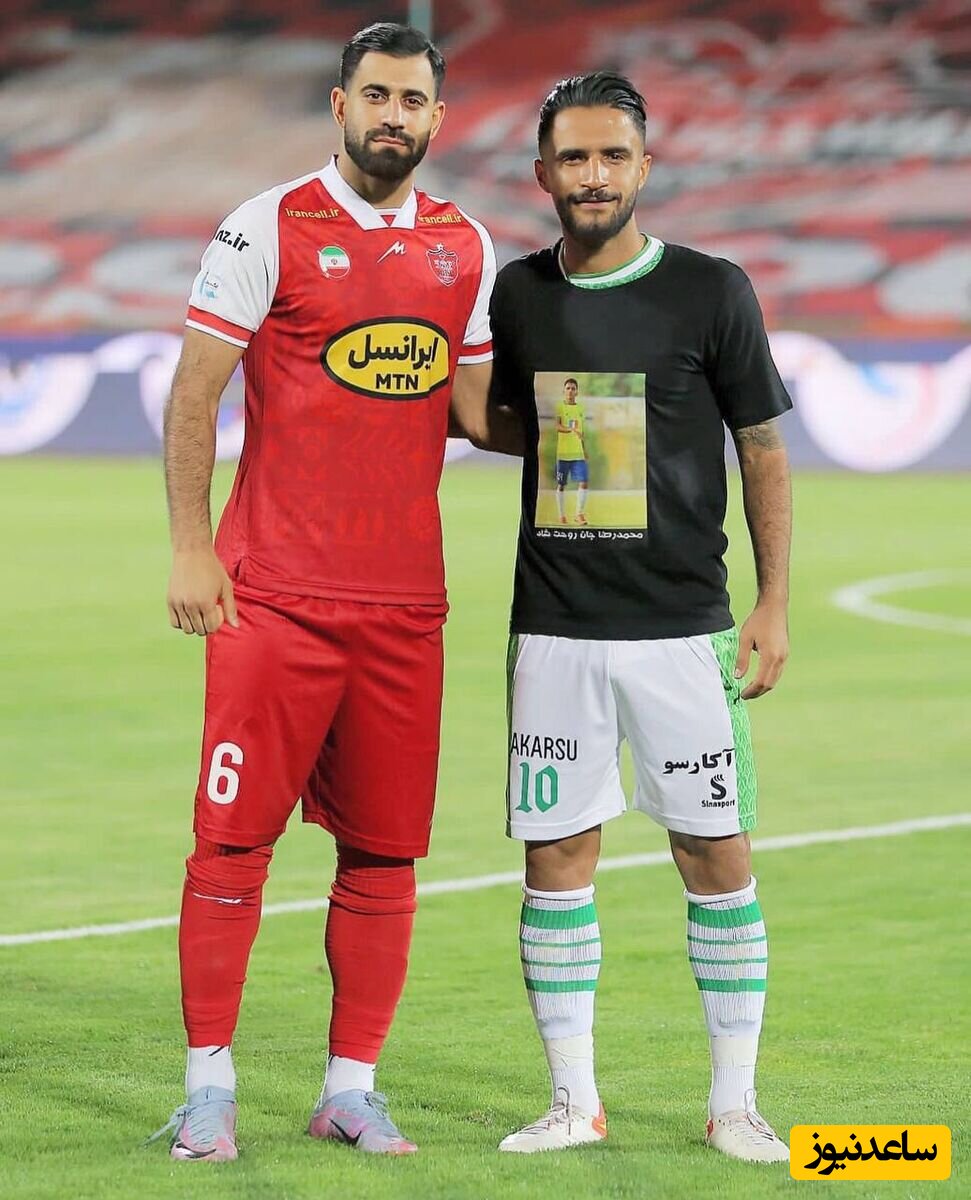 حسین کنعانی زادگان در کنار بازیکن فوتبال