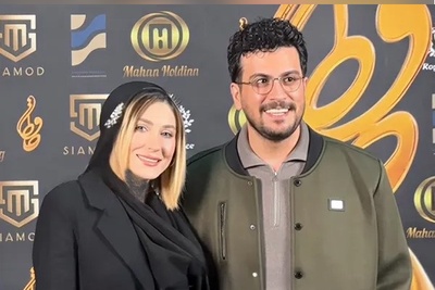 نگاهی به استایل ناهماهنگ و متفاوت امیرحسین قیاسی در کنار همسرش در جشن حافظ و خودنمایی کیف برندش که حسابی وایرال شد + ویدئو