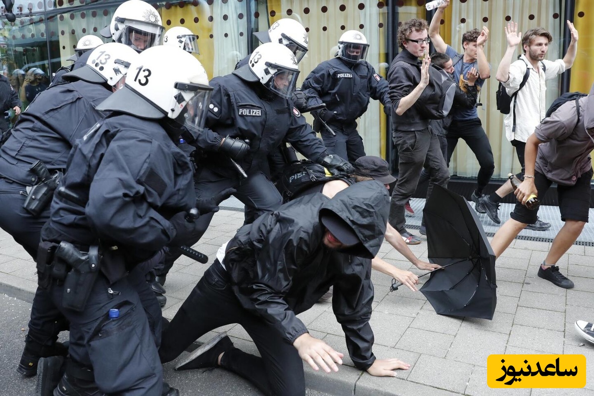 (ویدیو)مشت‌زنی و لگدمال کردن دختران‌ به قجیع‌ترین حالت! کتک کاری پلیس آلمان با معترضان/ هیتلر مرده ولی راهش ادامه داره!