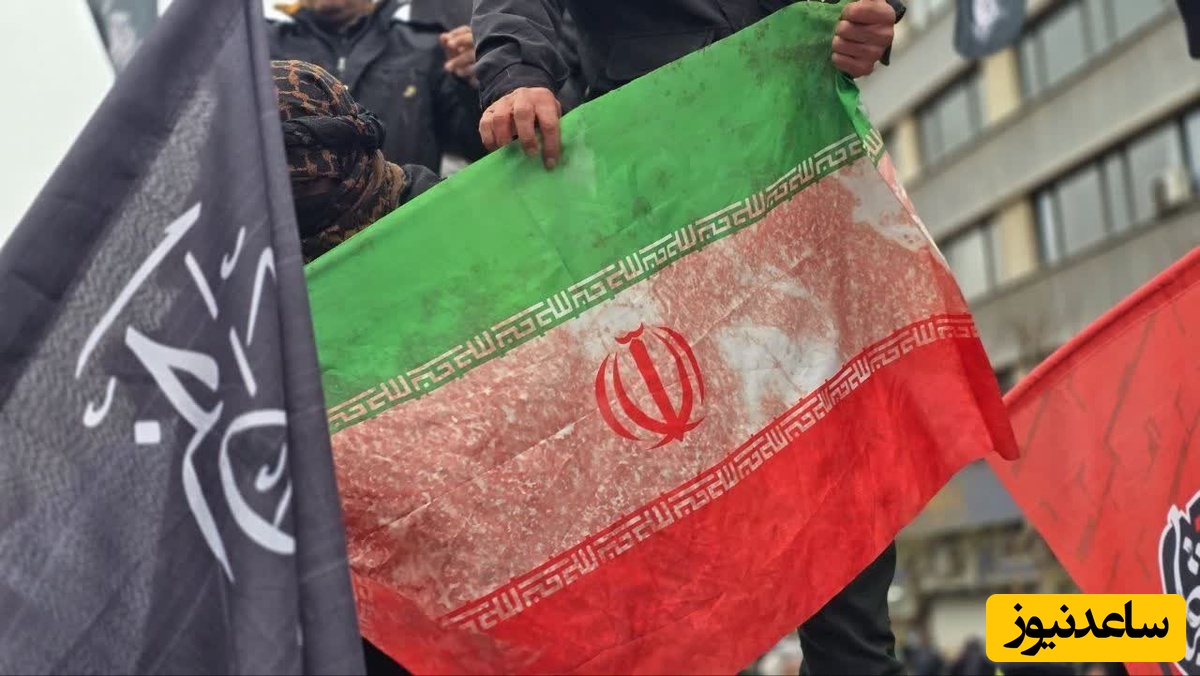 عکس | تصاویری از خون یک مادر روی پرچم ایران در حمله امروز دشمن به راهپیمایی روز قدس در تهران / ای پرچمت ما را کفن