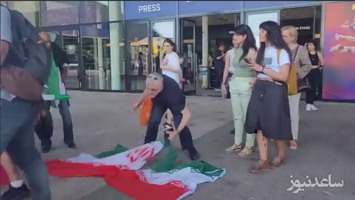 (فیلم) مرد با غیرتی که پرچم ایران را از زیر پای براندازان جمع کرد