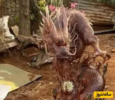 خلاقیت هوش پران هنرمند خوش ذوق برای طراحی و ساخت مجسمه اژدها با تنه درخت