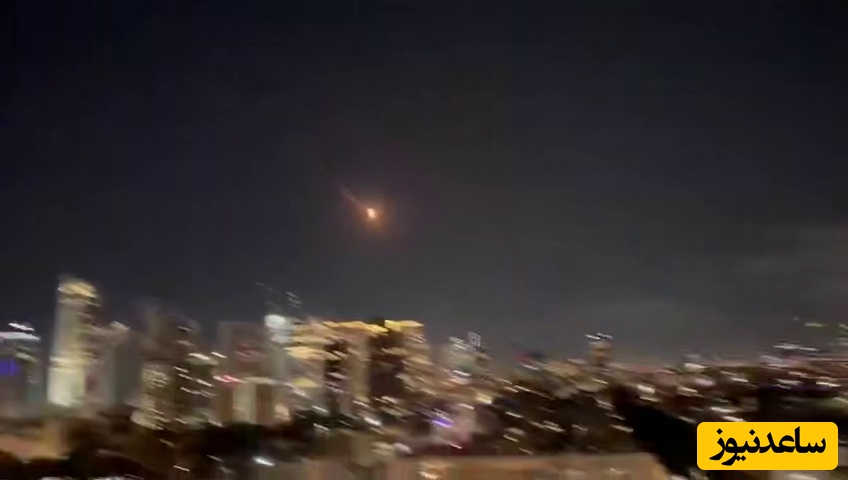 نمایش خیره‌کننده موشک ایران مقابل دو تیر موشک پدافندی (احتمالا تاد) و اصابت سهمگین به هدف در تل‌آویو / زجه بزن صهیونی+ ویدیو