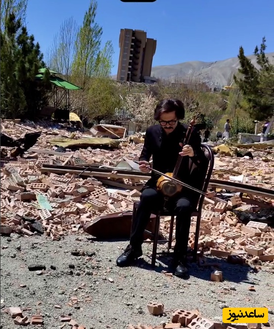 (ویدئو) کمانچه‌نوازی غم‌انگیز در ویرانه‌های دانشگاه شهید بهشتی؛ نوایی که حتی بمب‌ها نتوانستنند خاموشش کنند