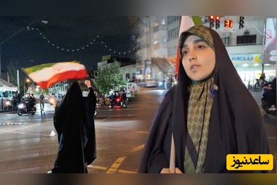 ببینید | دختری که با پرچم به سرکار می‌رود و تنهایی پرچم می‌گرداند / غیرتت دختر، غیرتت ...