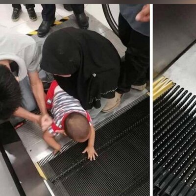 لحظه هولناک گیر کردن یک کودک در پله برقی
