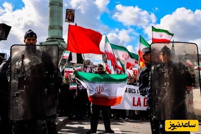 (فیلم) همخوانی با آهنگ «حسبی الله» محسن چاوشی در تجمع مردمی حمایت از ایران در پاریس/ میان دشمن و وطن ننگ بر آن که شک کند