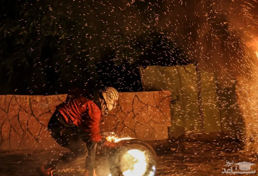 آتش زدن تایر در جریان تظاهرات ضداسراییلی فلسطینی ها 