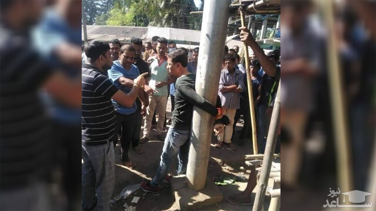 (فیلم) مردم، سارق اتومبیل را به تیر برق بستند
