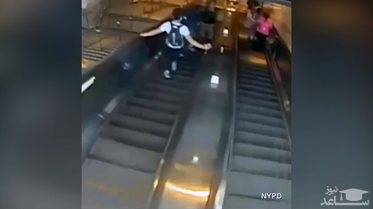 (فیلم) اقدام خشن مرد آمریکایی در مقابل زن جوان روی پله برقی 