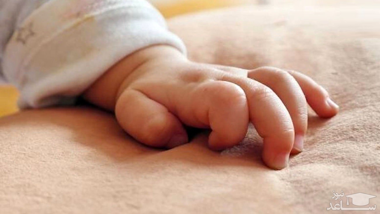 (عکس) نوزاد افغان در آغوش یک تفنگدار دریایی آمریکا